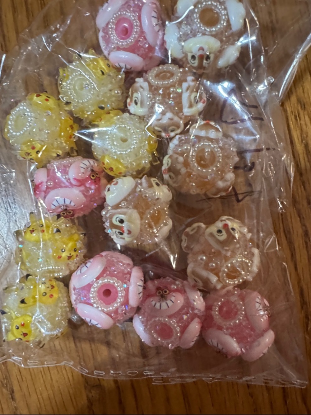 15 pieces of fancy beads. Pikachu, chershire cat and Dale